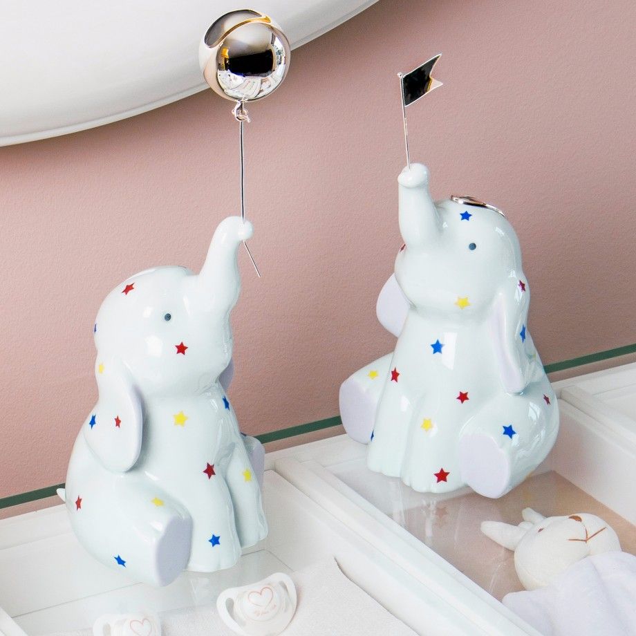 mealheiro circo elefante branco com estrelas coloridas segurando balao e bandeira Carmo Joalheiros